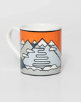 Mug with Italian cyclist destination Stelvio design, features snow-capped mountain and an orange background