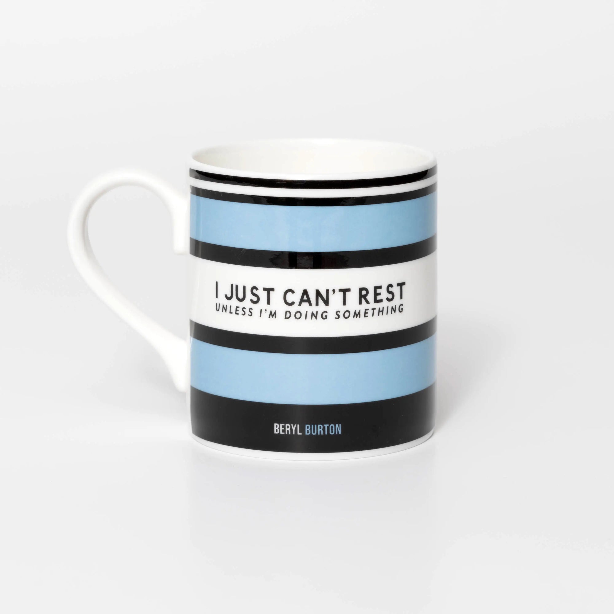 Mug with blue and black striped design and quite from iconic cyclist Beryl Burton, on a white background