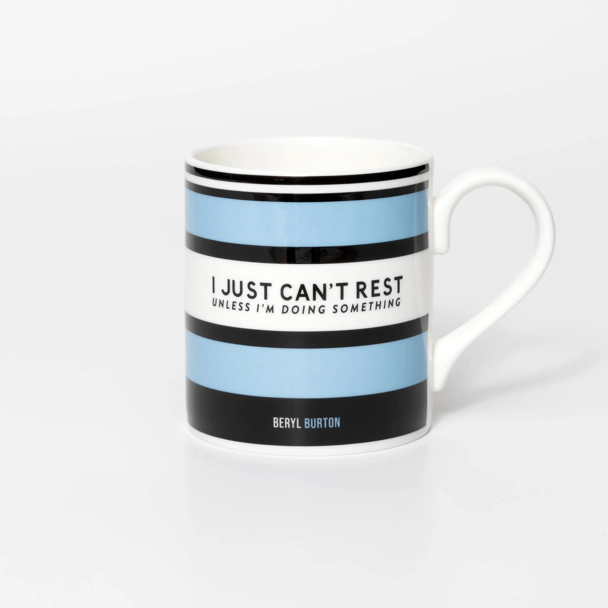 Mug with blue and black striped design and quite from iconic cyclist Beryl Burton, on a white background