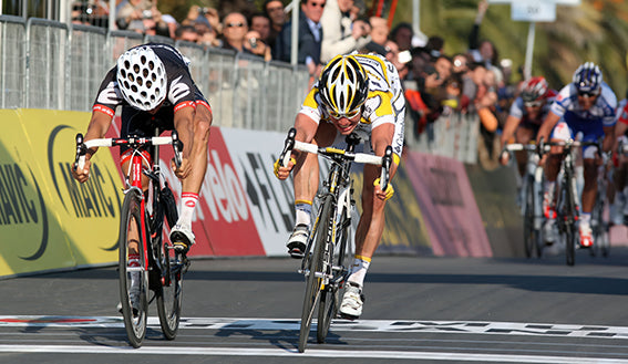 Mark Cavendish and Heinrich Haussler lunge for the line at the finish of Milan-San Remo. 