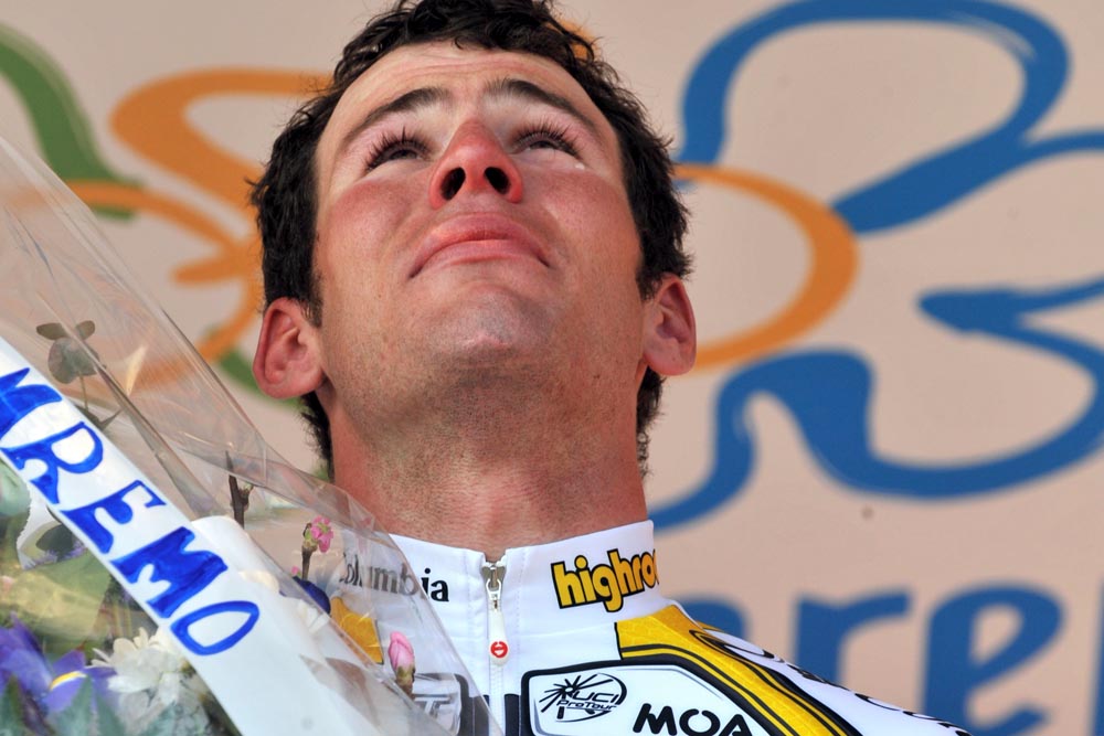 Mark Cavendish on the winner's podium after winning Milan - San Remo bike race in 2009.