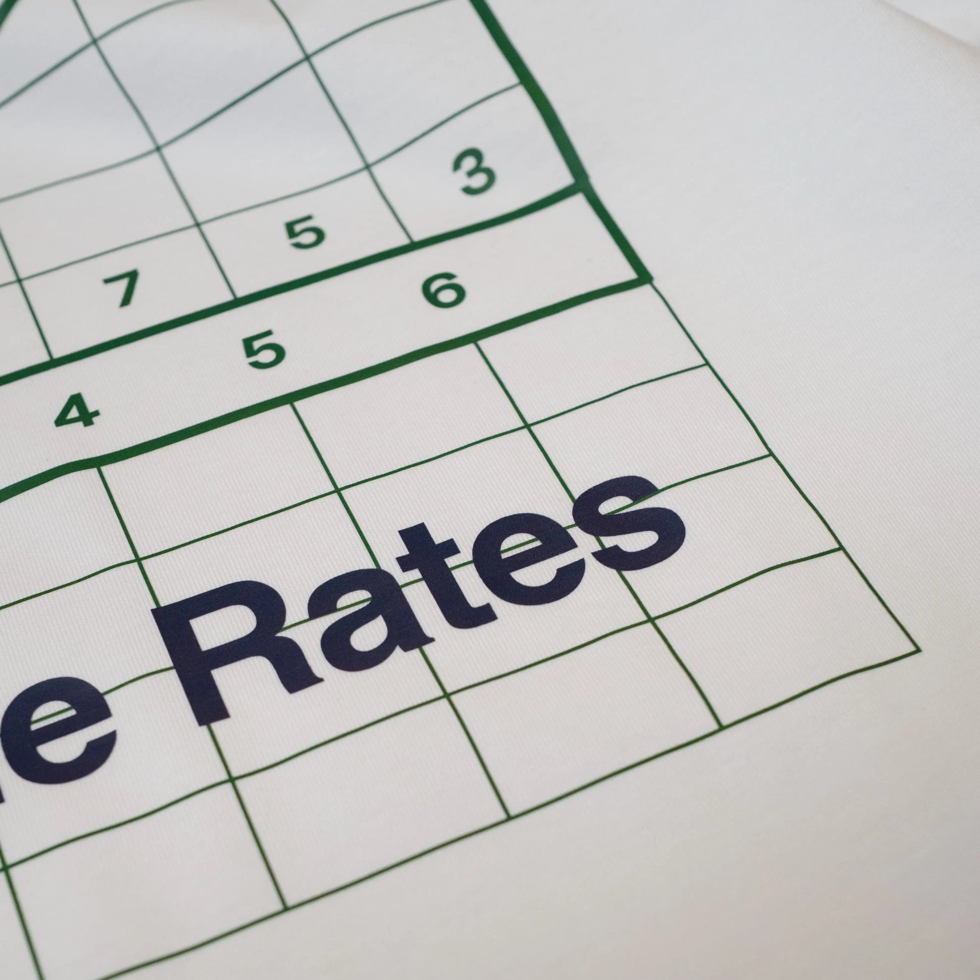 Close-up of white Climbs Profiles T-shirt with Spanish cycling climb Coll de Rates' graphic, by the Handmade Cyclist