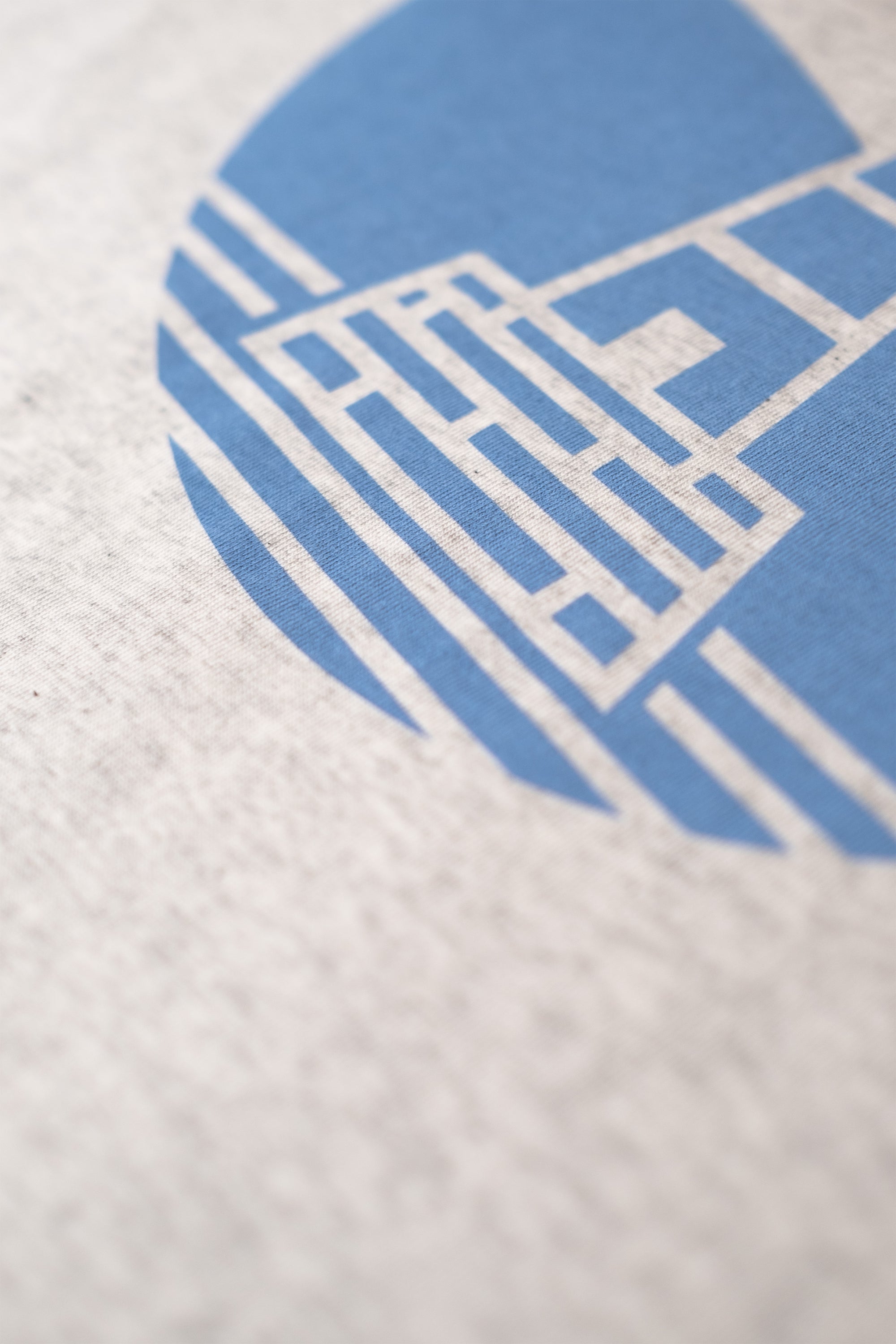 Close-up of a cycling t-shirt with L'Alpe D'Huez print design by The Handmade Cyclist.
