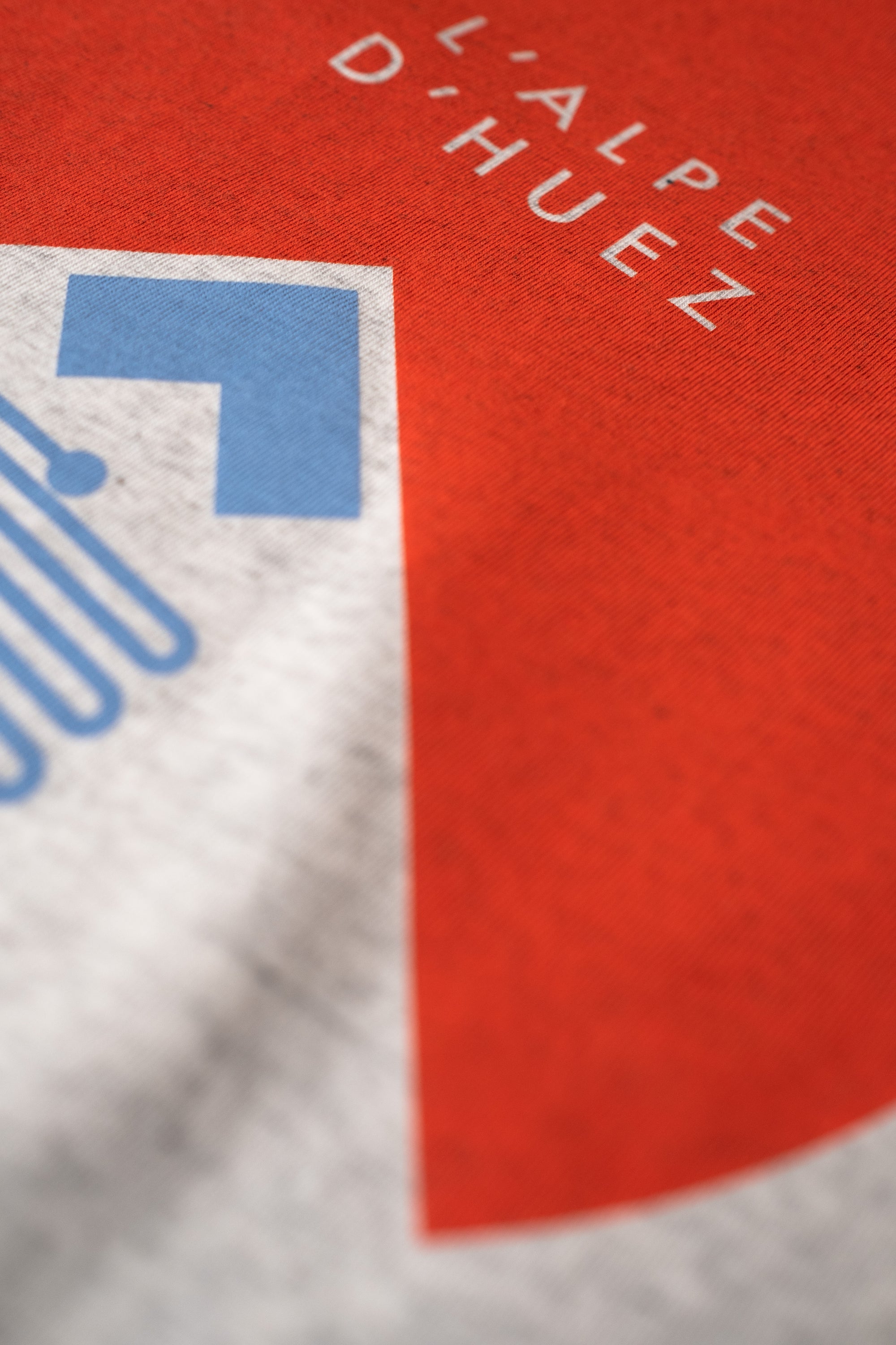 Close-up of a cycling t-shirt with L'Alpe D'Huez print design by The Handmade Cyclist.