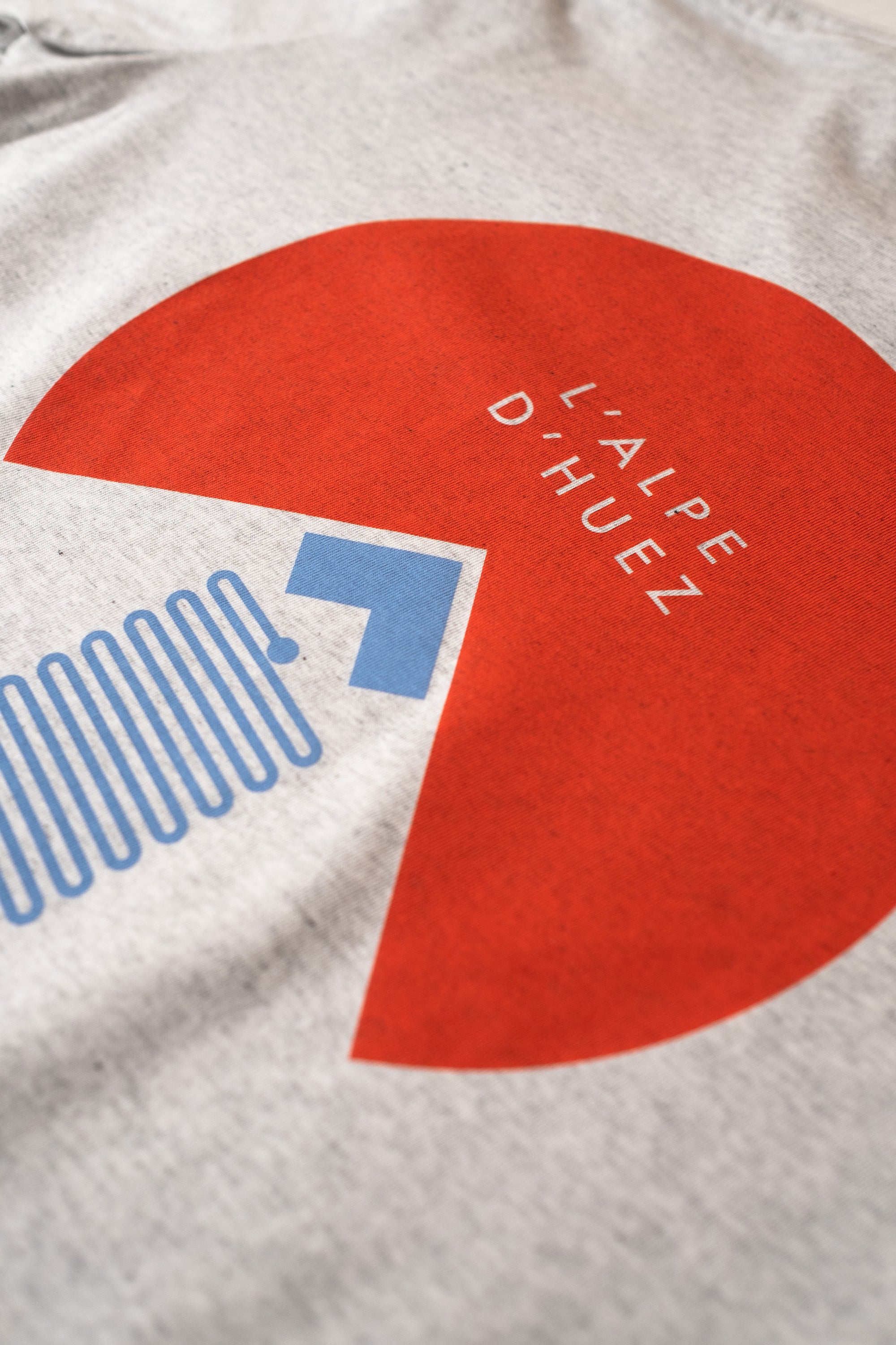 Close-up of a cycling t-shirt with L'Alpe D'Huez print design by The Handmade Cyclist.