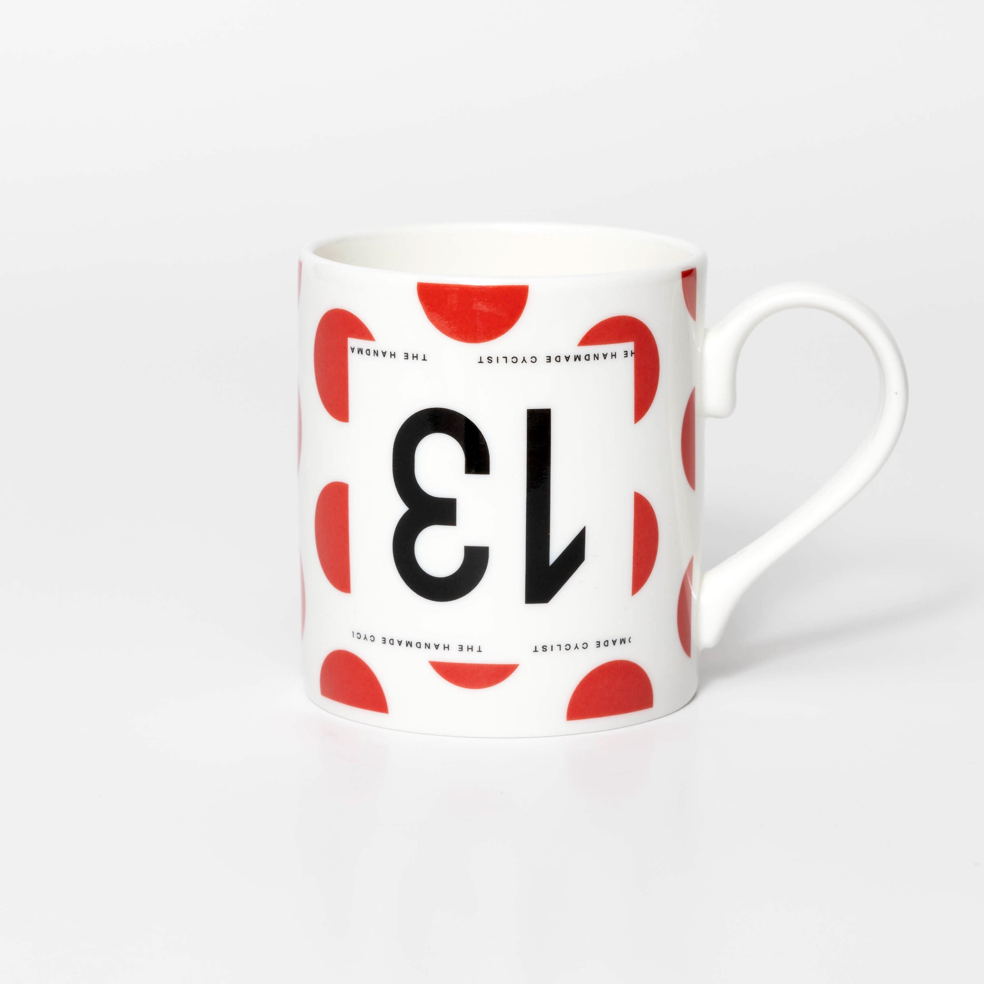 Polka Dot mug with black 13 in the style of a Tour de France cyclist's race number.