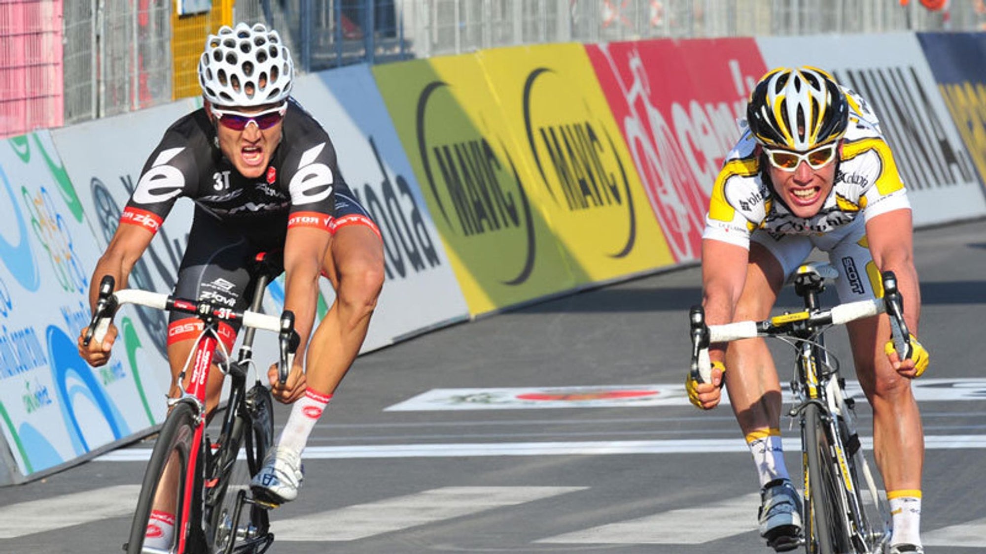 Heinrich Haussler and Mark Cavendish cross the finish line at Milan-San Remo 2009